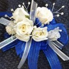 1 a wrist corsage with roses and flair 1